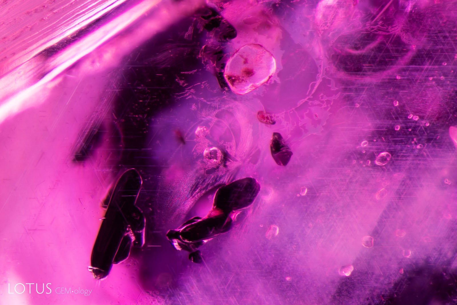 (1100°C) The fissures have expanded and begun to heal, though the primary rutile crystals appear unaltered and the rutile silk needles in the background are intact.