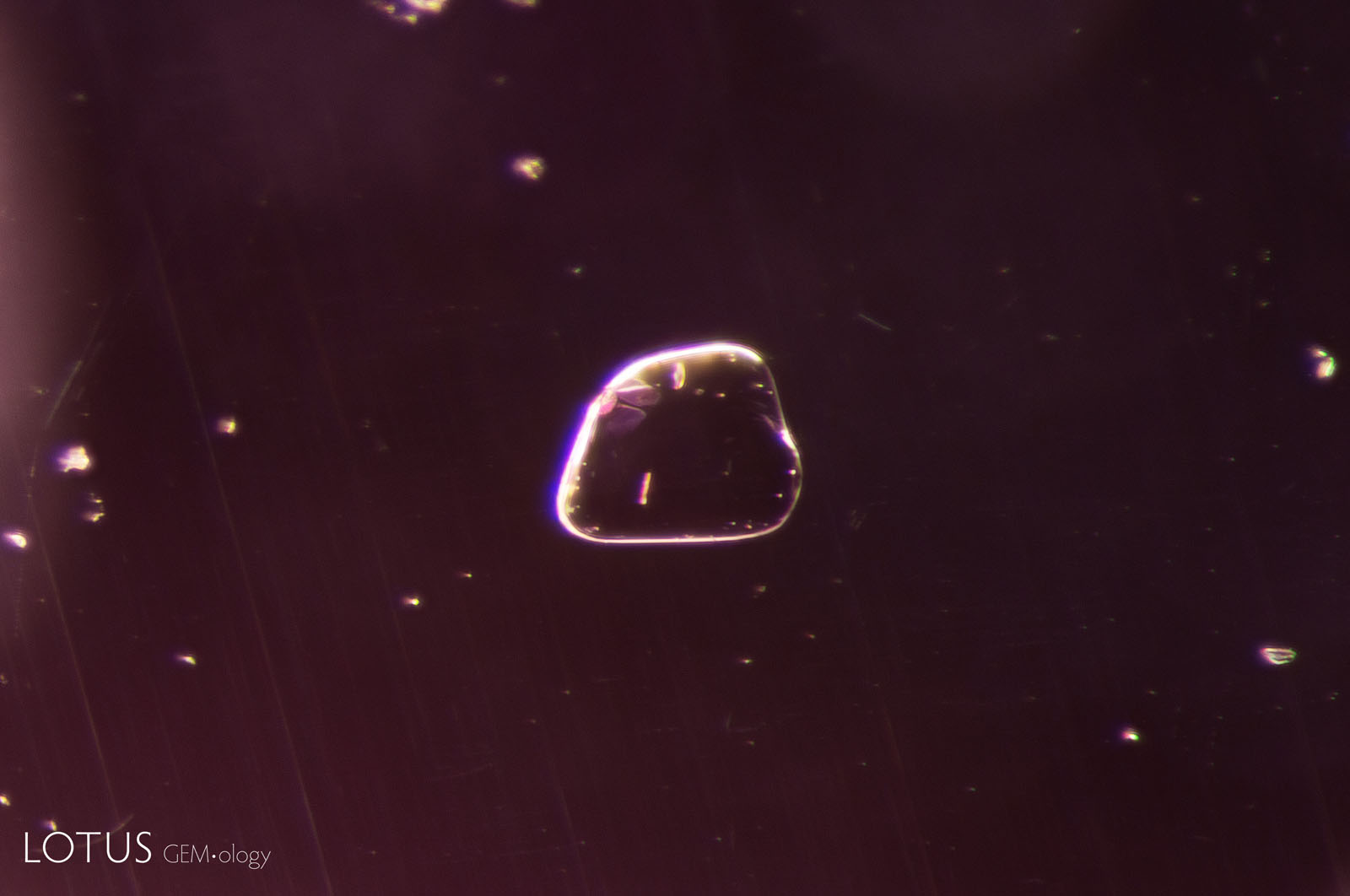 (Unheated) This transparent spinel crystal in sample 39 retains the same appearance through subsequent rounds of heating to 600°, 750°, and 900°C.