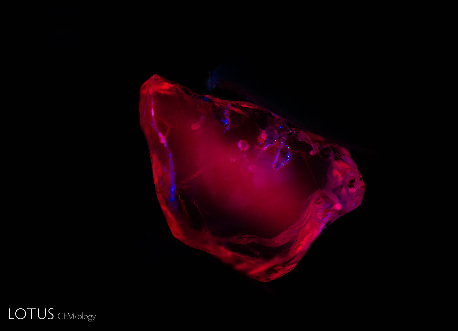 Sample 18 displays a strong red fluorescence in short-wave UV before heat treatment. It retains this appearance after heating to 600°, 750°, 900°, and 1100°C.