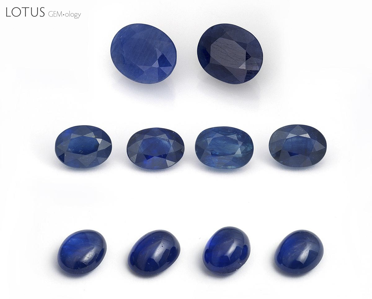 Figure 2. Two first-generation cobalt-doped glass-filled sapphires (top row; 3.49 & 3.37 ct), along with eight latest-generation cobalt-doped glass-filled sapphires ranging from 1.50&ndash;2.25 ct each that were tested as part of this study. Note the far lower clarity of the first-generation stones. Photo: Wimon Manorotkul