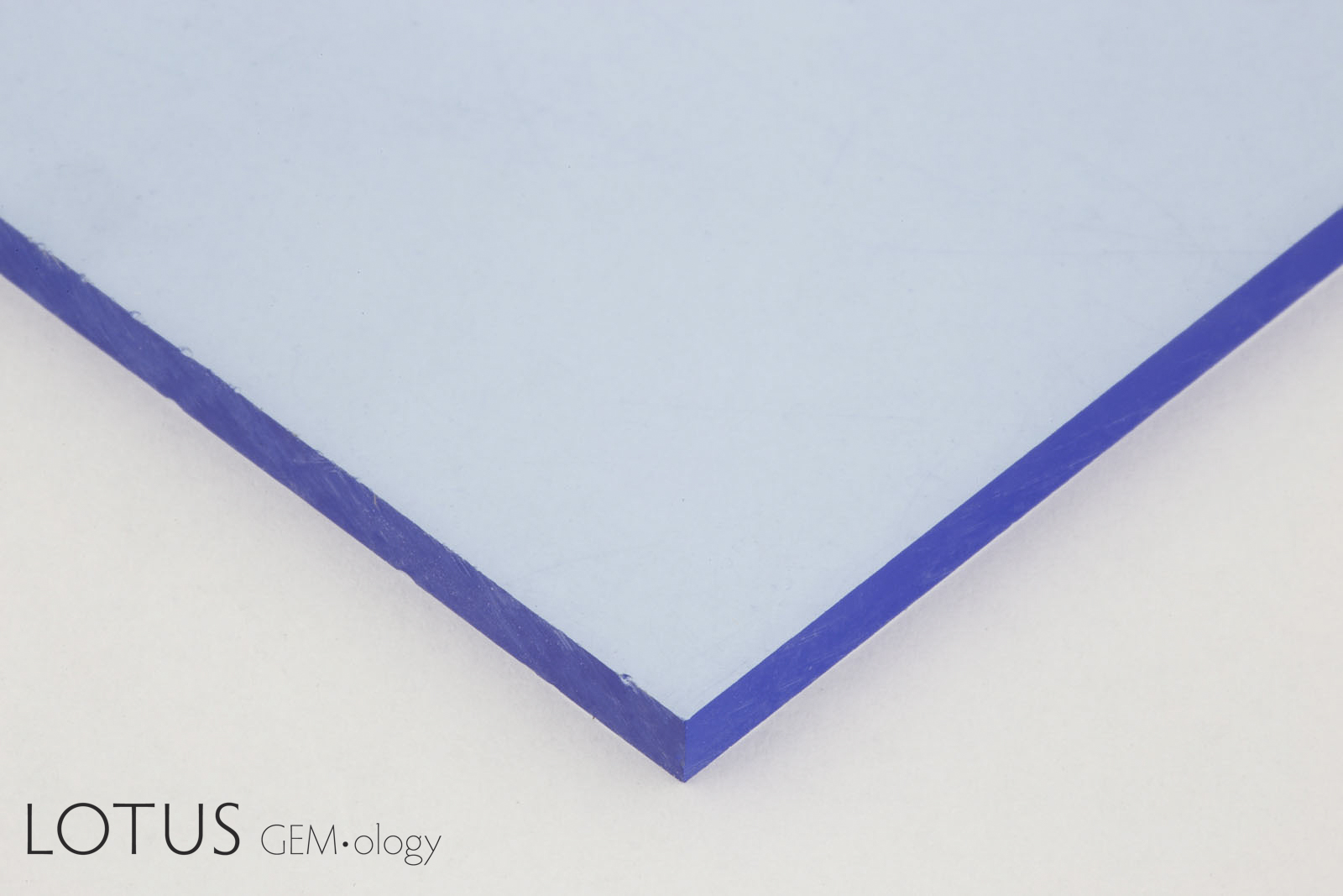 One of the easiest ways of understanding the relationship of path length to absorbance is to simply look at a colored plate. Through the broad side, there is little color visible, but the edges are deeply colored. This is because the path length of light traveling through the plate&rsquo;s edges is a hundred or more times longer than that traveling perpendicular to that direction. Photo: Lotus Gemology