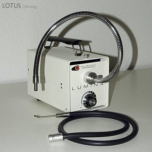 Figure 7. A fiber-optic system such as that shown above offers unparalleled illumination. Shown are both a stiff &ldquo;goose-neck&rdquo; light guide, which is good for photography and a flexible rubber-sheathed light guide, which is best for everyday use. The flexible light guide has a pinpoint illuminator extension, which is also quite useful. Photo: Richard Hughes.