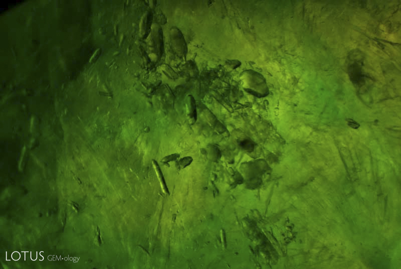 A cluster of zircon inclusions in jadeite jade