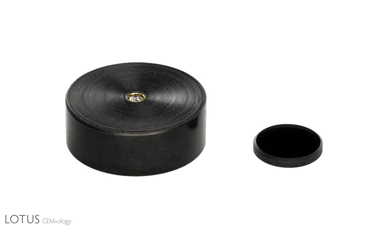 Figure 3: Left: The Laser Calibration Tool, a diamond set into a plastic holder (diameter approximately 2.5 cm).  Right: The neutral density filter. Photo: E. Billie Hughes/Lotus Gemology