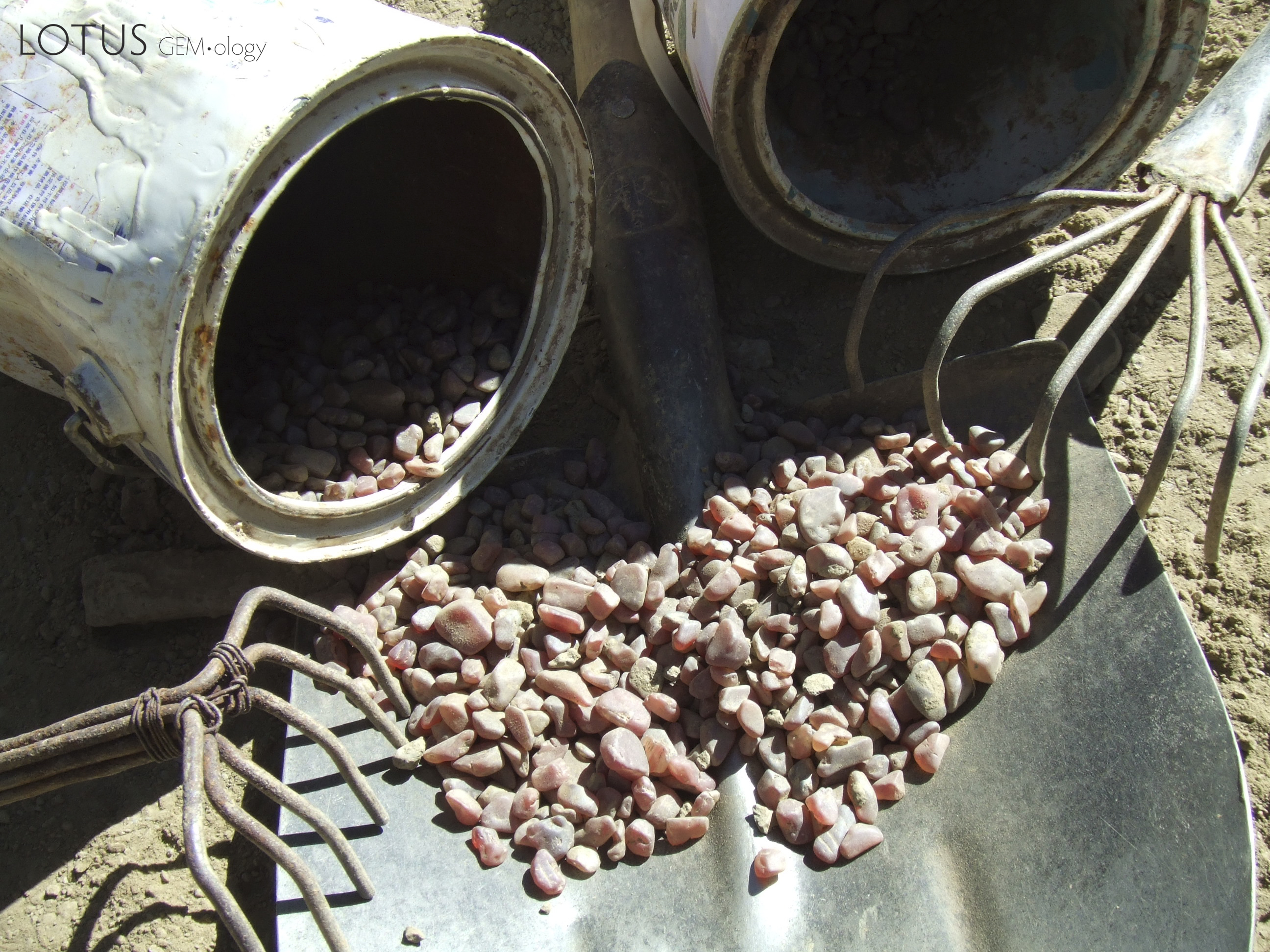 Figure 4. According to one internet pundit, this image from Ahmadjan Abduriyim's 2008 trip to Tibet shows tools that are too clean, the buckets without enough wear and the gemstones too perfectly matched to be representative of an actual mining operation.  In order that readers can get a better look, Ahmadjan Abduriyim has provided an extremely high-resolution image. Make your own decision on these stones and tools. We report, you decide. Photo: Ahmadjan Abduriyim