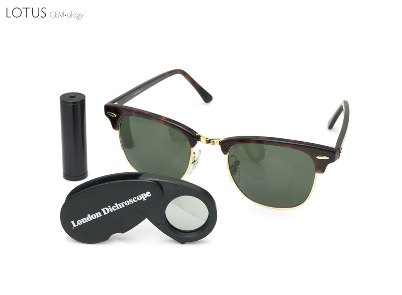 Figure 14. Three tools for observing pleochroism: the calcite dichroscope, the polaroid-plate dichroscope and polaroid sunglasses. Polaroid sunglasses make an effective field tool, as simply rotating a pleochroic gem in front of them will allow one to observe the different colors (albeit one color at a time). A polariscope with the polarizer and analyzer in the parallel position can also perform the same function. Photo: Wimon Manorotkul