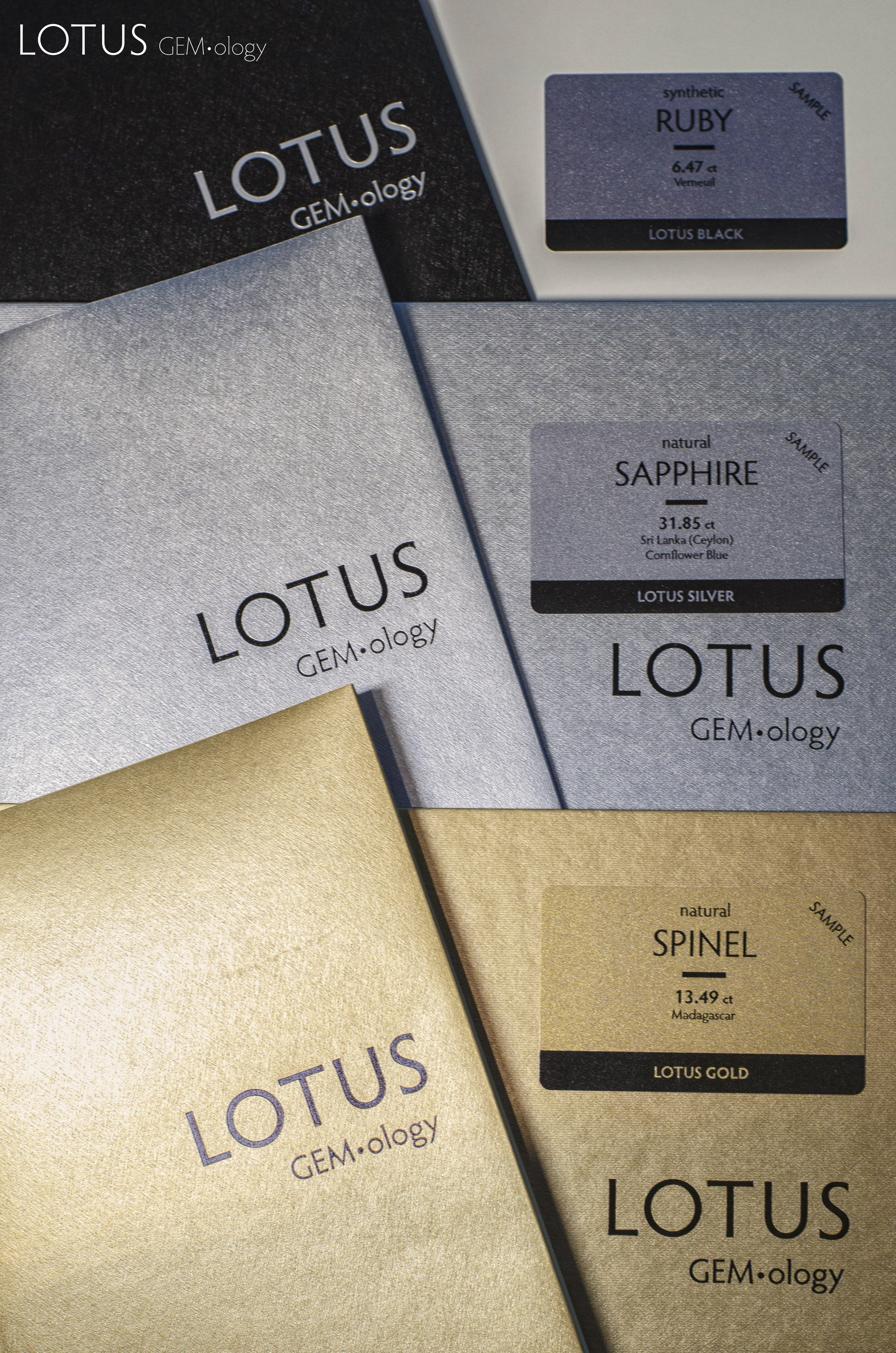 Lotus Gemology gold, silver and black reports. The color-coded report covers offer clients explicit enhancement disclosure at a glance.