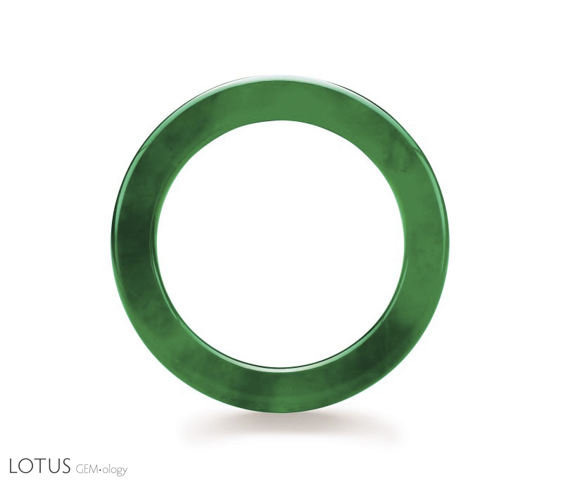 Figure 6. Believed to date back at least four millennia in China, the jade bangle is both one of the oldest and one of the most important pieces of jewelry in the Chinese culture. This superb jadeite bangle sold for US$2,576,600 at the Christie's Hong Kong November 1999 auction. The interior diameter is 49.50 mm; the jadeite is 8.36 mm thick. Photo courtesy of and &copy; Christie's Hong Kong and Tino Hammid.