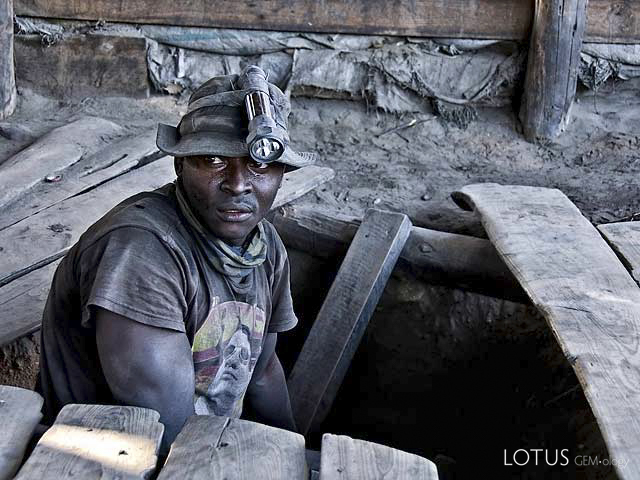 A graphite-coated miner emerges from the shaft at Merelani's Block D. Photo: Richard W. Hughes