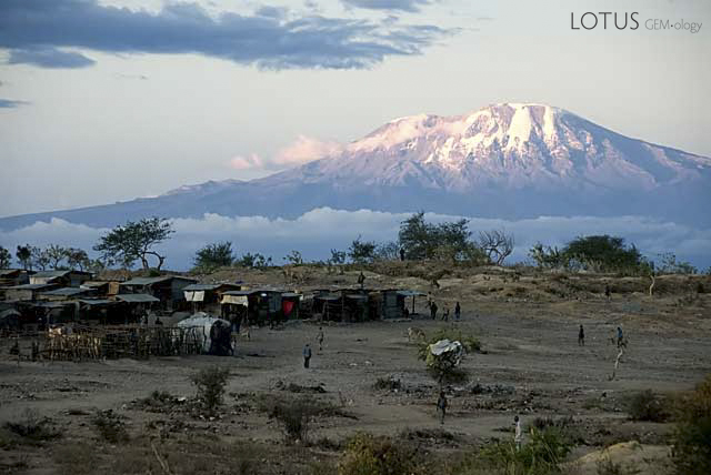 The snows of Kilimanjaro rise in majestic splendor from Merelani's tanzanite mines. This ice-capped dormant volcano is not just Africa&rsquo;s highest peak, but at 5,895 meters (19,340 ft), also one of the world&rsquo;s tallest freestanding mountains, rising from farmlands through lush rainforest to alpine meadows and, finally to the snowcapped twin summits of Kibo and Mawenzi. While known to Africans from time immemorial, in the sixth century Chinese mariners reported a &ldquo;great mountain&rdquo; inland. It did not enter European knowledge until 1849 when a German missionary, Johannes Rebmann, reported a snow-capped peak just three degrees below the equator. According to Chagga tribal legend related to King Solomon&rsquo;s mines, a great treasure is said to exist on the mountain, protected by powerful spirits ready to punish any foolhardy enough to dare climb it.&nbsp;Photo: Richard W. Hughes