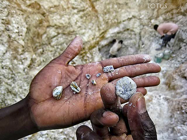 Straight from the ground, Songea sapphires from Ngembambili Amanimakoro (Songea) are often coated with a clay crust. Photo: Richard W. Hughes