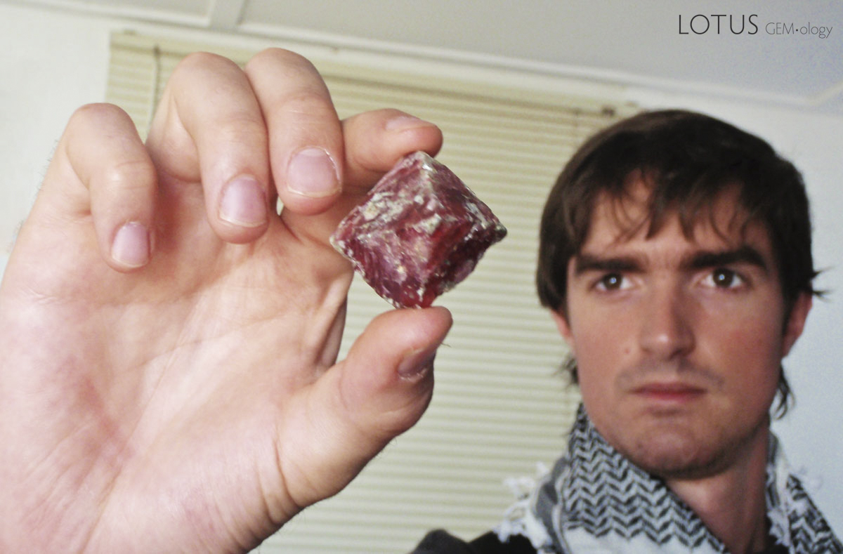 Philippe Brunot holding a spinel crystal from Mahenge. Photo &copy; Guillaume Soubiraa