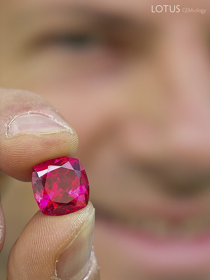 Eric Saul displays a spectacular red Mahenge spinel, cut from one of the large crystals found in the summer of 2007. Among connoisseurs, the finest Mahenge spinels have acquired a reputation second-to-none. Photo: Vincent Pardieu