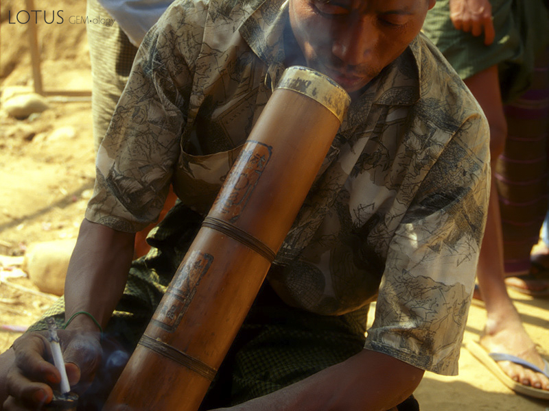 A miner takes a break to have a cigarette at Hpakangyi. Such Chinese bamboo water pipes (bongs) are also used for smoking opium, to which many miners are addicted. Inset: Despite its toughness, much jade is polished on bamboo lathes, such as this one in Mandalay's jade market.