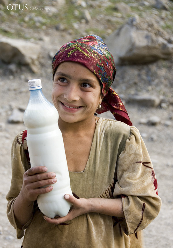 Got milk? A Tajik girl offers fermented milk to weary travelers in the remote Badakhshan region of Tajikistan. Photo &copy; Richard W. Hughes.