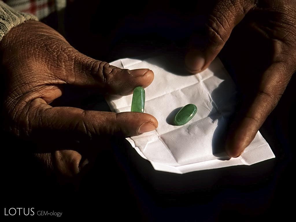 Top: Plastic-coated jadeite cabochons on offer in Mandalay's jade market.