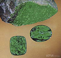 Figure B-3. A "cousin" to jade, maw-sit-sit is an attractive ornamental stone that is an intergrowth mainly of albite, clinochlore, kosmochlor, chromian jadeite, and eckermannitic amphibole. These two maw-sit-sit cabochons weigh 9.87 ct (oval) and 8.48 ct. Courtesy of Pala International; photo &copy; Harold & Erica Van Pelt.