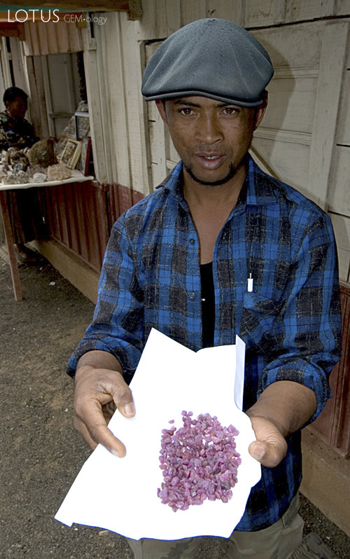 Ambohimandroso ruby rough on offer in the gem market at Antsirabe. Photo: Richard W. Hughes