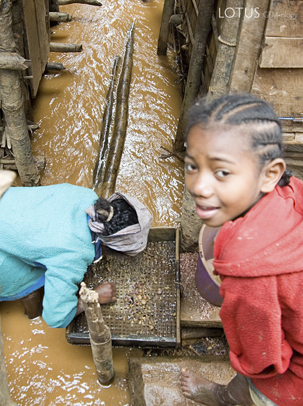 Mining the muddy streets of Moramanga. Photo: Richard W. Hughes