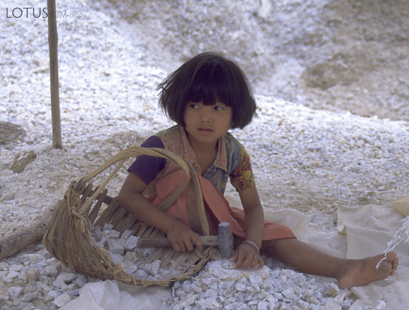 A young&nbsp;kanas&eacute; ma&nbsp;breaks marble in search of rubies at Kyauk Saung, in Myanmar's Mogok Stone Tract. She told the author it was her summer holiday, and that she would be back in school in a few days. Photo: R.W. Hughes