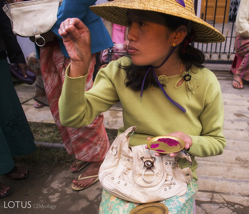 Examining rubies in one of Mogok's many markets. Photo: R.W. Hughes