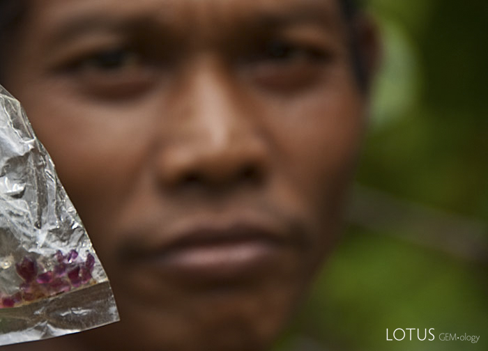 One of Thailand's last ruby miners with the day's take. Photo &copy; Richard W. Hughes, April 2009.