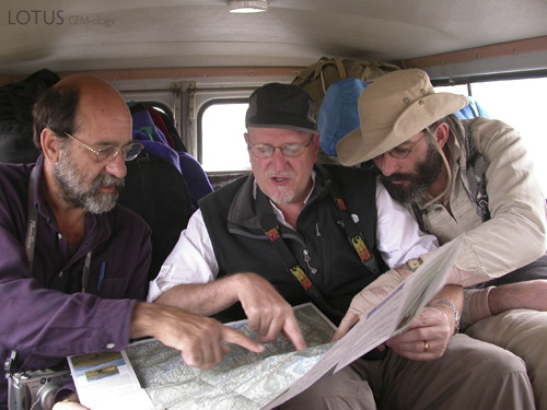 Dana Schorr, Richard Hughes and Vincent Pardieu examine the route to Badakhshan's ruby and spinel mines. Photo: Surat Toimastov