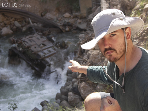 Guillaume "Guji" Soubiraa points out a drowned tank, reminder of the civil war that raged across Tajikistan for several years following independence from the Soviet Union. Photo: Vincent Pardieu/fieldgemology.org