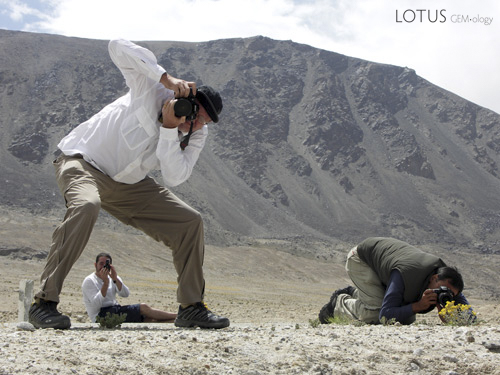 Photomaniacs Richard Hughes, Guillaume Soubiraa and Surat Toimastov gettin' some along the Pamir Highway. Photo &copy; Vincent Pardieu/fieldgemology.org