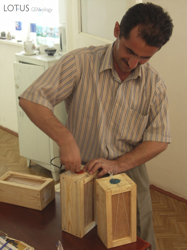 Boxes of rough ruby from the Snezhny mines are unsealed at the Gubjemast office in Dushanbe. Photo &copy; Vincent Pardieu/fieldgemology.org