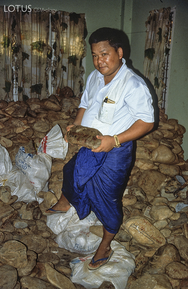 A room with a view U Tin Ngwe, who went from taxi driver to jade kingpin almost overnight, stands atop a small fortune of jade at his Hpakan home.