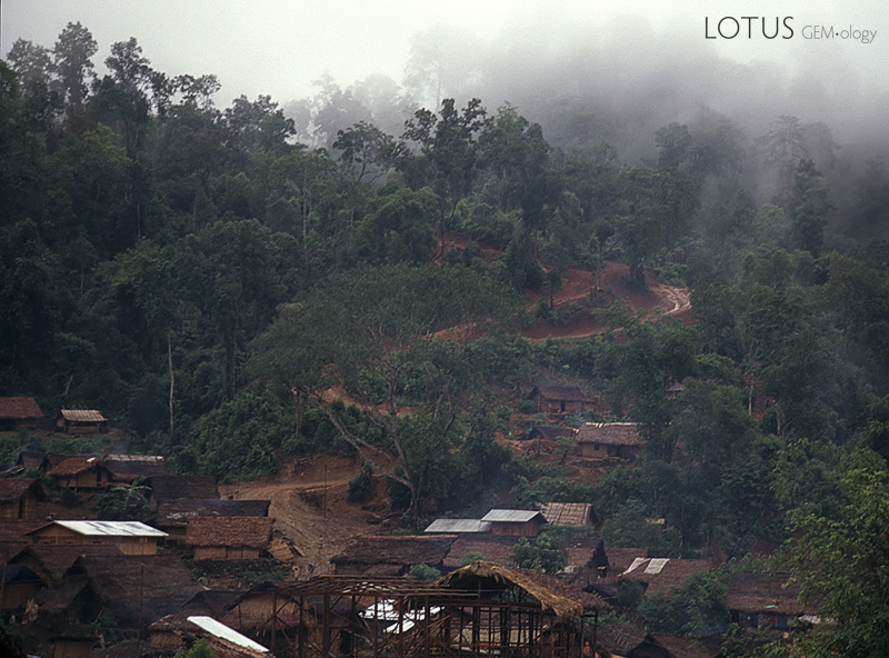 The small village of Hweka, with the rain-soaked track to Hpakan leading into the mist