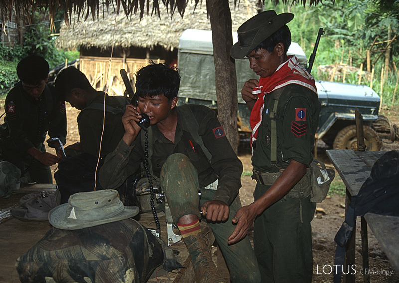 Our military escort radios headquarters from Namlam, deep in Burma's Kachin State.